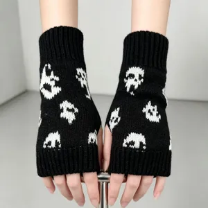 Gants tricotés noirs sans doigts avec motif de crâne blanc pour hiver et fête d'Halloween.