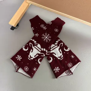 Burgundy knit leg warmers with winter snowflake and sheep pattern for women and girls.