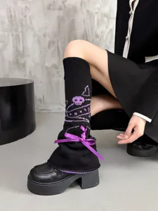 Black knit leg warmers with purple bow and cute cartoon skull pattern, JK style fashion socks.