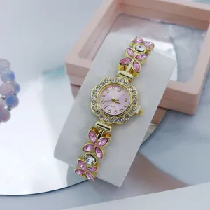Elegant women's quartz bracelet watch with pink dial and sparkling crystal flower detail