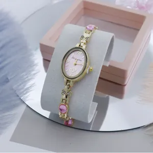 Elegante reloj de cuarzo para mujer con esfera rosa ovalada, diamantes de imitación y pulsera.