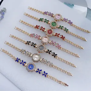 Stylish women quartz bracelet watch with crystal flower charm, elegant multicolored jewelry time.
