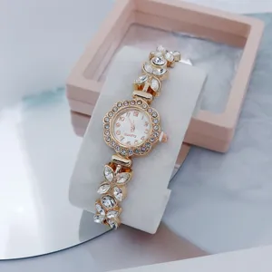 Exquisite rhinestone quartz watch detail, stunning floral dial and crystal butterfly bracelet.