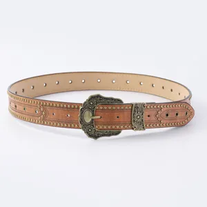 Vue détaillée de la ceinture en cuir western vintage avec boucle florale et clous métalliques.
