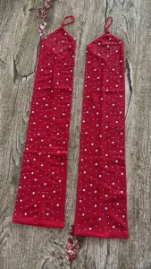 Red mesh rhinestone long gloves detail view, sparkling crystals for special stage performance.