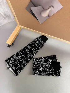Black cat knit leg warmers detail, cute JK slouch socks for autumn and winter daily cozy wear.