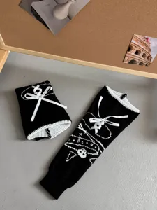 Black white knit leg warmers with bows skull pattern JK style alternative fashion winter warm.