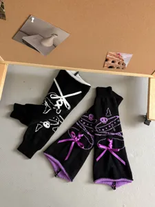 Dark JK style knitted leg warmers with bows and skull patterns, trendy Harajuku fashion leg covers.