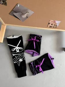 Knit leg warmers featuring skull patterns, velvet bows, and stylish drawstring details for daily wear.