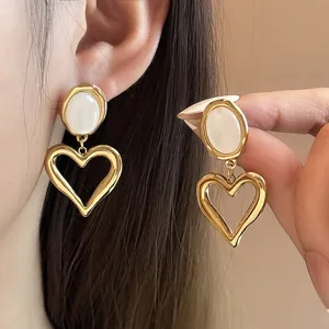 French vintage hollow heart earrings with white cat eye stone for women elegant chic jewelry.