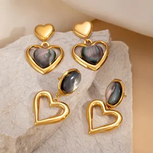 French vintage style hollow cat's eye stone heart titanium steel earrings for women.
