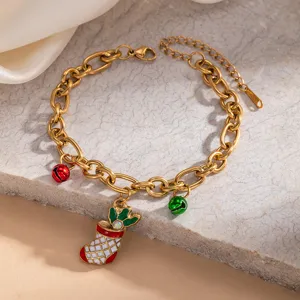 Christmas stocking charm bracelet detail, gold tone stainless steel holiday jewelry.
