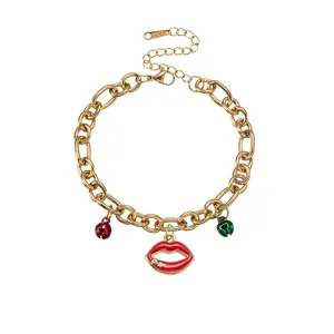 Gold stainless steel chain bracelet featuring red lips rhinestone pendant and holiday bells detail.