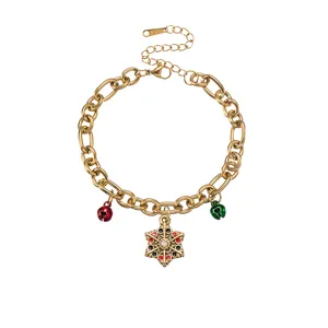Gold stainless steel chain bracelet featuring colorful enamel snowflake charm and festive bells.