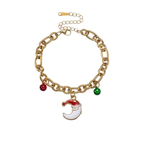 Close-up details of Christmas themed gold-plated stainless steel chain bracelet with enamel.