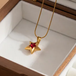 Exquisite gold-plated star pendant necklace featuring a sparkling red gemstone for women detail.