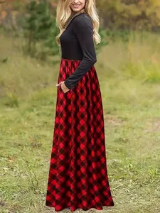 Side view of a women's round neck long-sleeve maxi dress with red and black plaid skirt