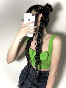 Women green crop tank top with fashion black long braided hair extensions for stylish look