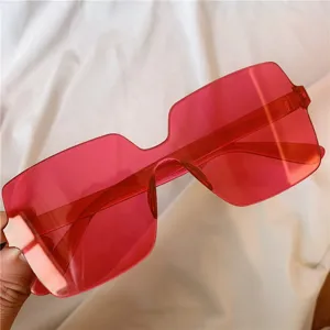 Modische rosa Oversize rahmenlose Sonnenbrille Detail, stilvolle rote Brille für Damen.