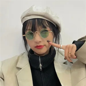 Retro round metal frame sunglasses for women and men, classic vintage punk hip hop eyewear.