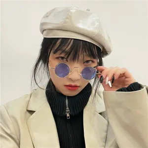 Retro round sunglasses for women and men, vintage metal frame with purple tinted lenses chic.