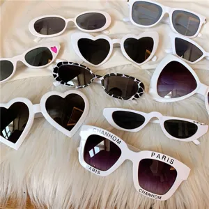 Harajuku white fashion sunglasses set featuring heart, oval and cat eye frames for women.