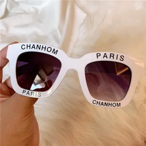 White retro chunky frame sunglasses for women, fashionable street style UV protection.