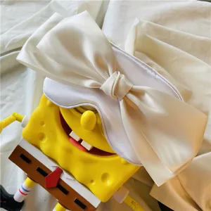 Joli masque de sommeil en satin blanc avec nœud, confortable, respirant et ombrageant pour sieste.