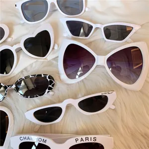 Detail view of stylish white frame fashion sunglasses in diverse trendy shapes and designs.