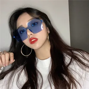 Trendy oversized frameless blue sunglasses for women, stylish street style sun eyewear.