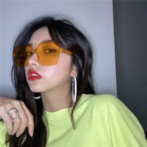 Retro square sunglasses with vibrant orange lenses, stylish streetwear fashion accessory.