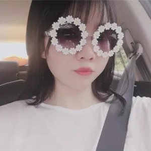 Trendy daisy flower round sunglasses for women, cute oversized eyewear for street style wear.