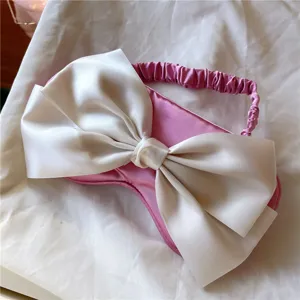 Joli masque de sommeil en satin rose avec grand noeud blanc confortable et occultant