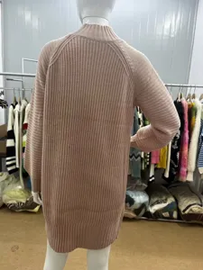 Women solid color long sleeve turtleneck ribbed knit sweater dress back view detail display.