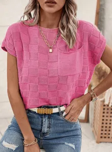 Detailed view of pink textured knit short sleeve top with checkerboard pattern and pocket.