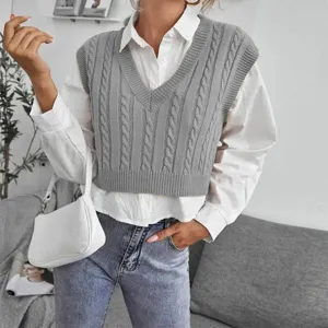 Grey cable-knit V-neck sweater vest detail, stylish sleeveless layering top for women.