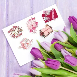 Detail view of bookish waterproof stickers featuring pink romantic designs with floral envelope art.