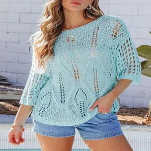 Detailed shot of light blue crochet hollow knit top showcasing delicate knit texture and design.