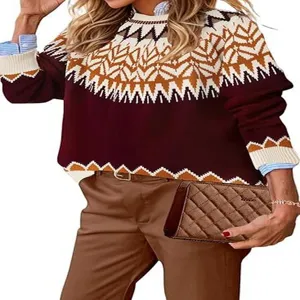Detailed shot of women's colorblock crewneck knit sweater with Nordic pattern and casual styling.