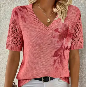 Close-up view of the V-neck knitted sweater featuring hollow-out sleeves and elegant floral print.