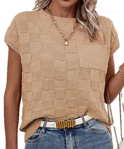 Details of women's short sleeve checkerboard knit top, showing texture and collar style.