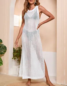 Detailed view of the hollow-out knit beach cover-up showing intricate mesh and sleeveless cut.