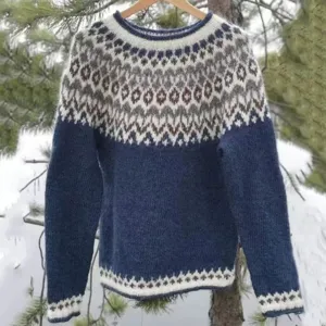 Cozy colorblocked crewneck long sleeve knit sweater featuring traditional Nordic geometric patterns.