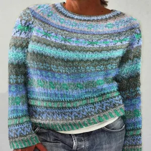 Close-up detail of the colorful striped knit sweater, showing soft texture and pattern.
