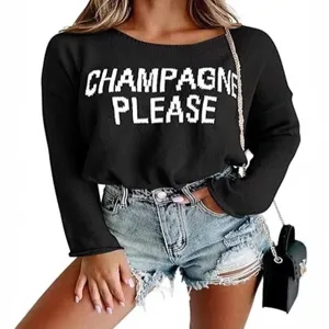 Women casual black long sleeve crewneck knit sweater with letter print and denim shorts.