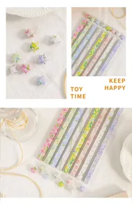 Bloemige origami papierstrips en geluksster details, perfect voor creatieve handwerk projecten.