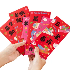 Festive red envelopes for Chinese New Year, thick lucky money packets with cute sheep design.