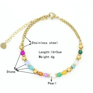 Detail view of gold-plated stainless steel bracelet with pearl and colored stones