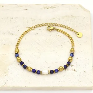 Close-up of titanium steel bracelet with lapis lazuli beads and freshwater pearl
