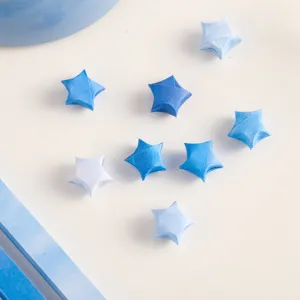 Handcrafted blue gradient origami lucky stars for DIY crafts and home decoration items